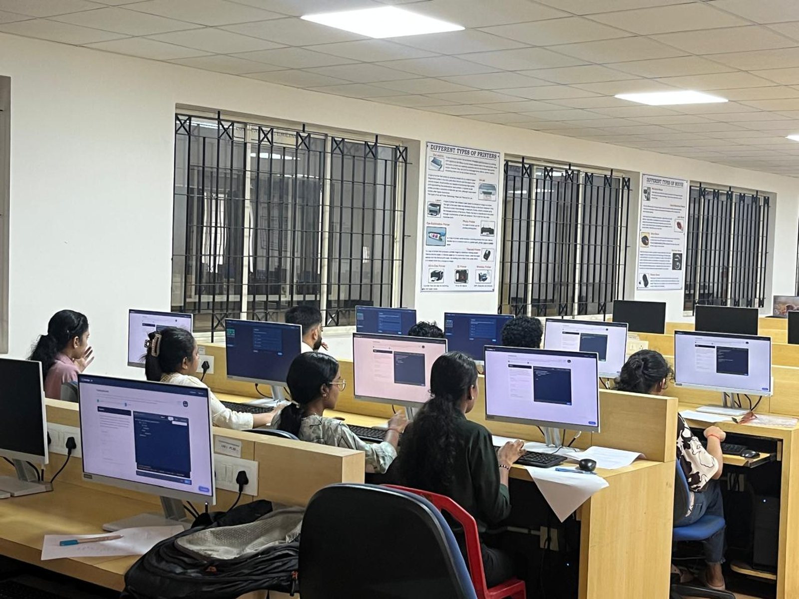 Students at a campus session, each on their own HireEdge round